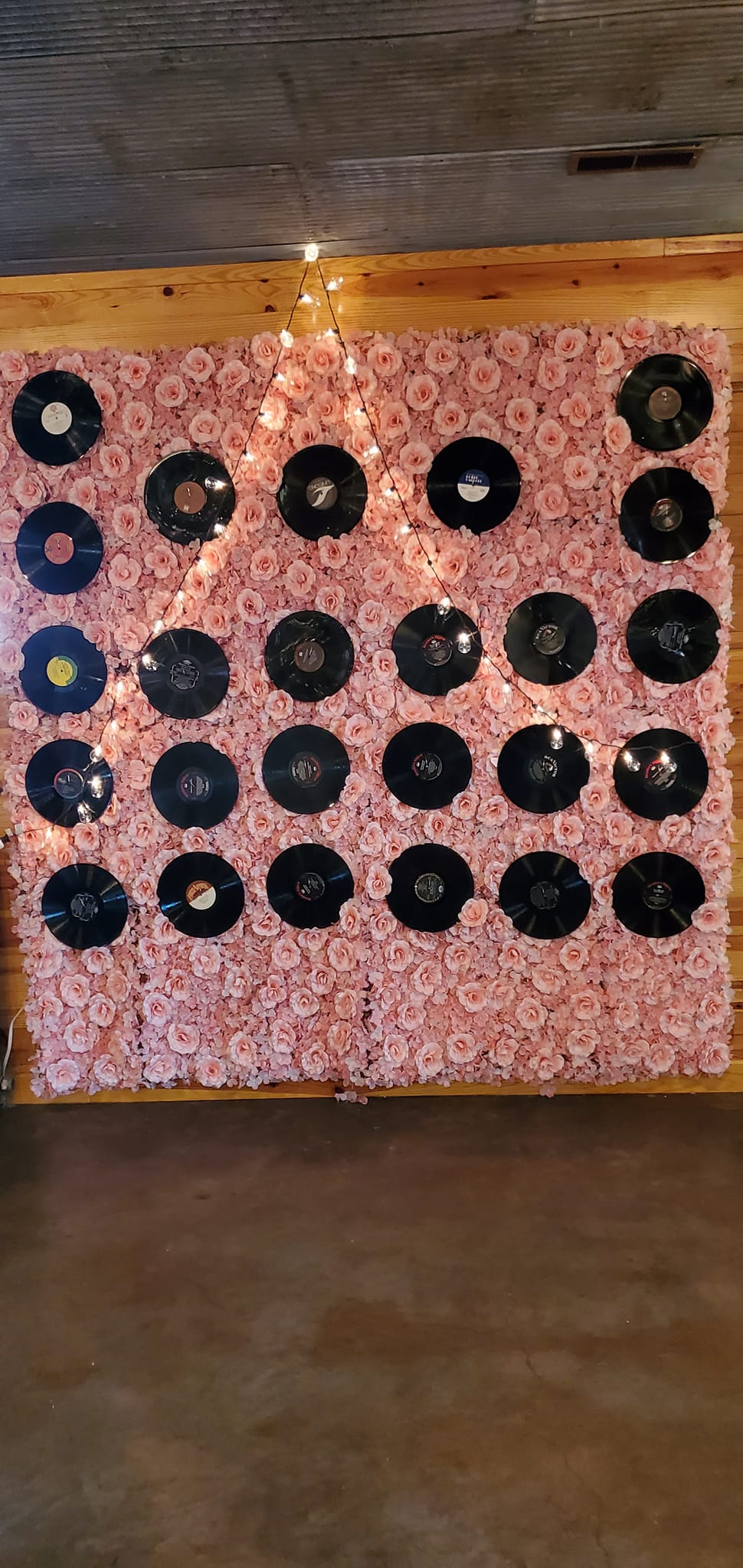 pink rose photo backdrop with vinyl records