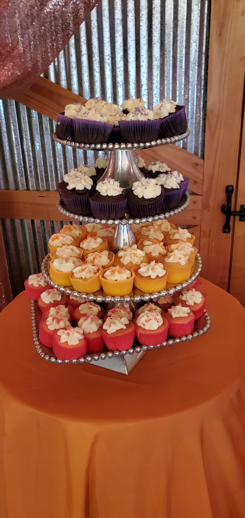 colorful cupcakes on tiered stand