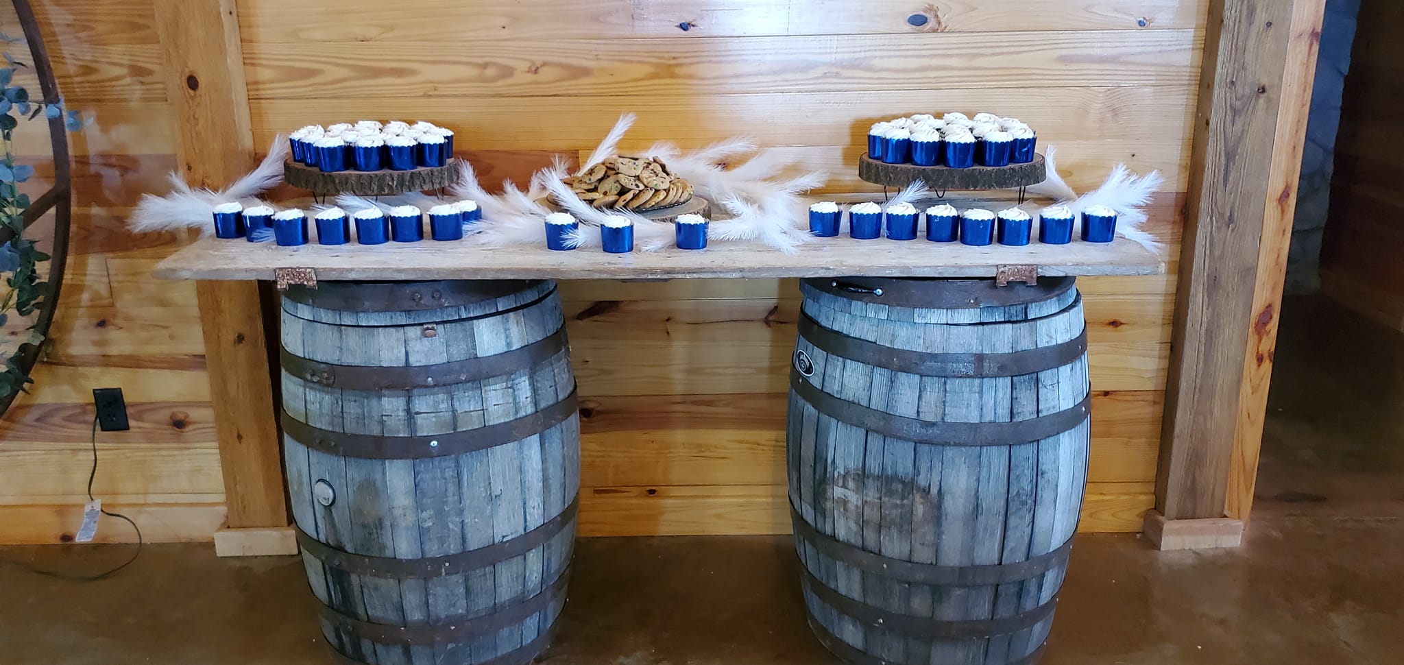 cupcakes on vintage whiskey barrel tables