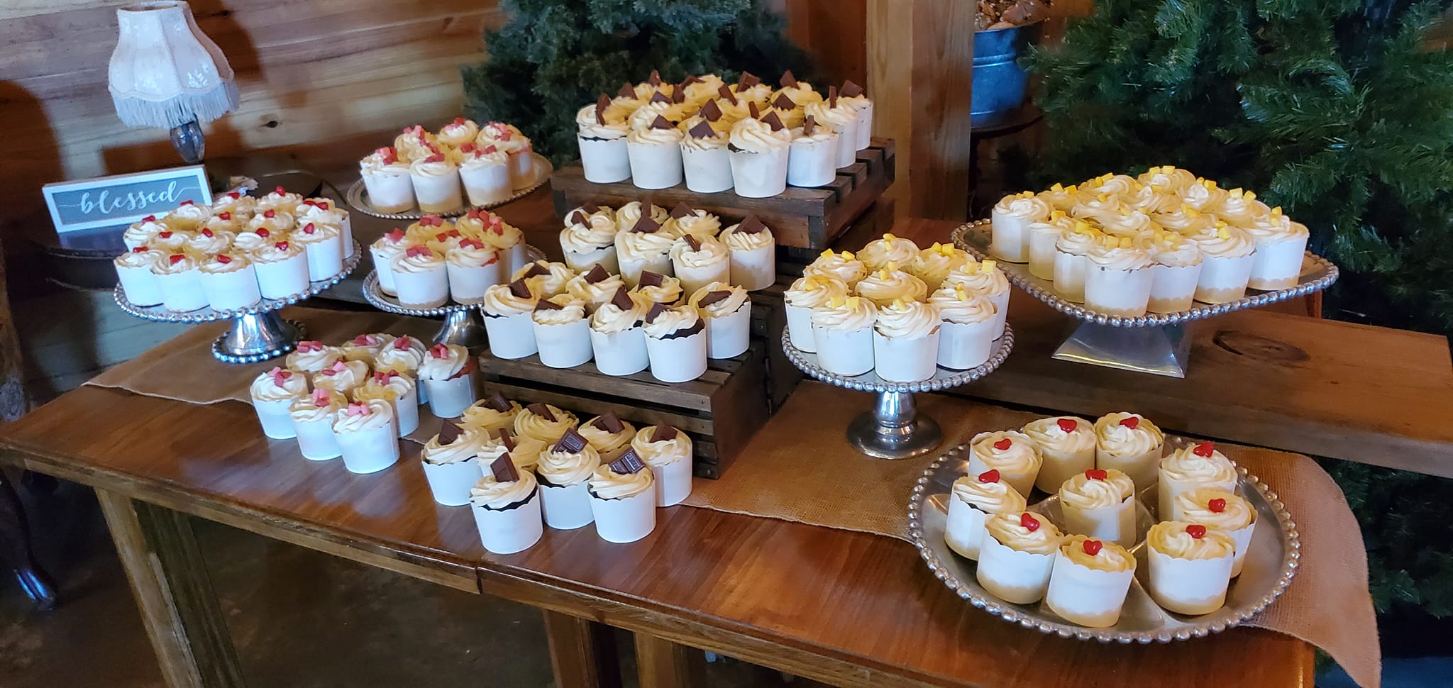 assorted cupcakes on pewter cupcake stands