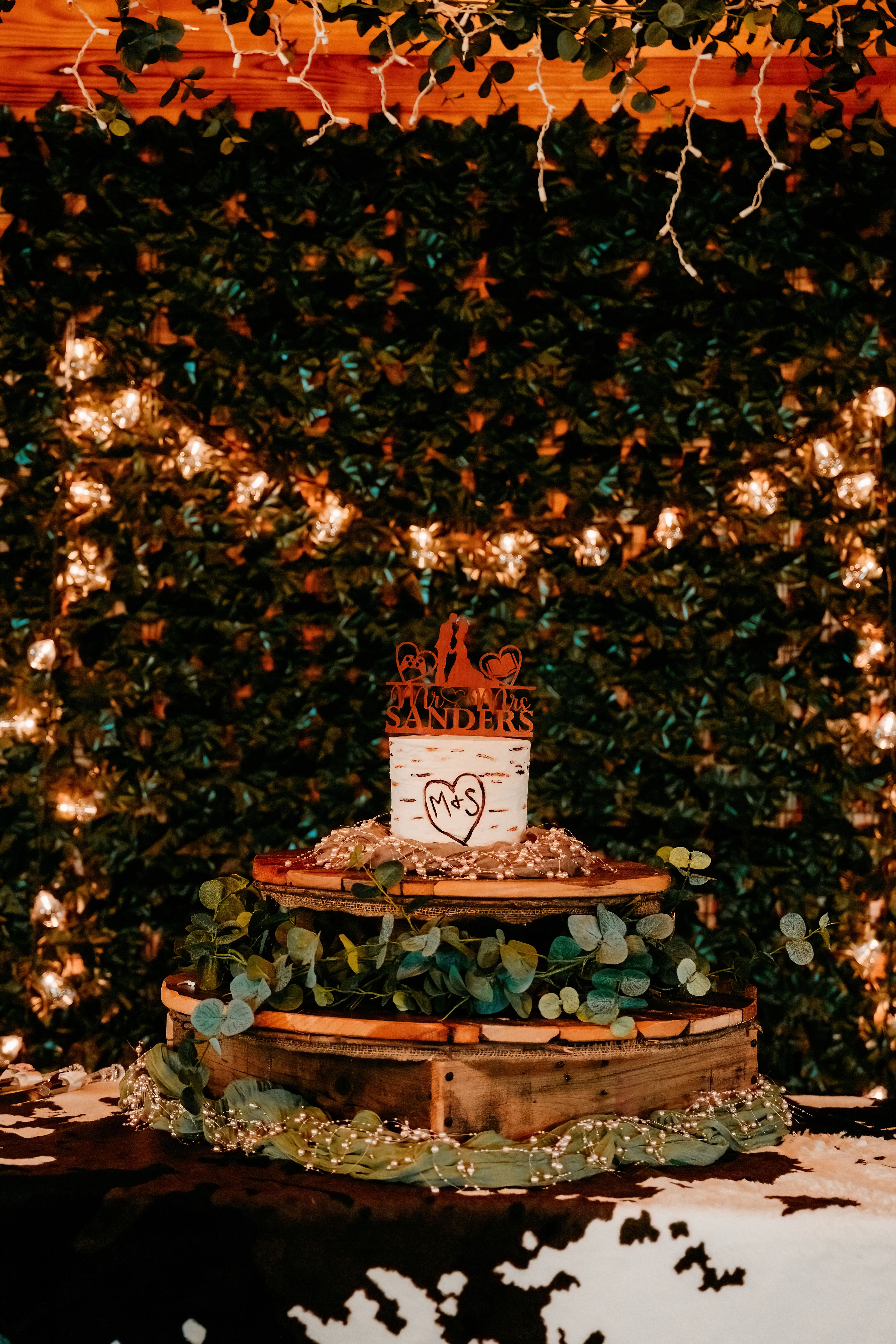 rustic wedding cake on wooden cake stand